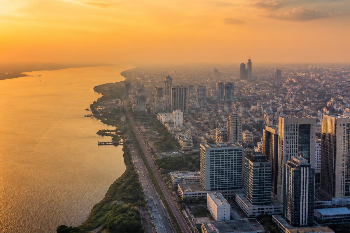 Aerial view of the Congo river and city skyline at golden hour